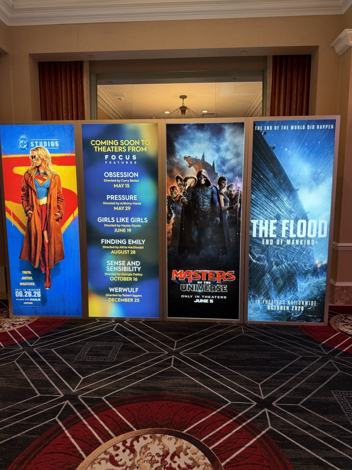 Focus Features 2026 slate lightboxes at CinemaCon, including Sense and Sensibility, Pressure, and Werwulf, alongside Supergirl, Masters of the Universe, and The Flood
